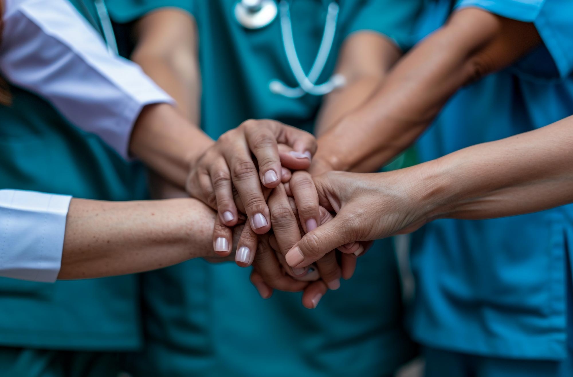 healthcare team hands together